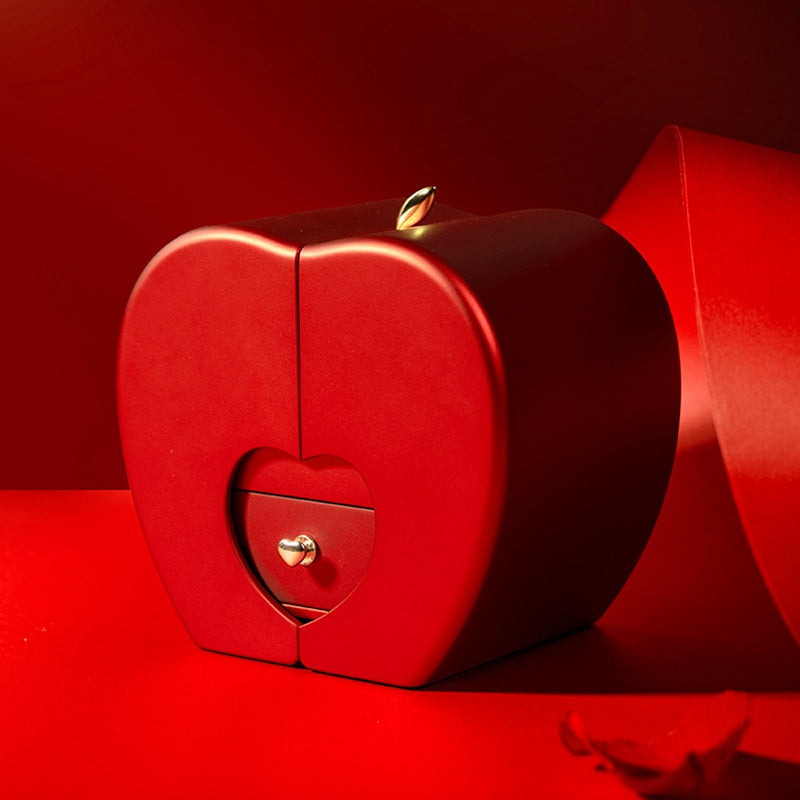 Red heart jewelry box with engraved heart panel and small stud clasp detail