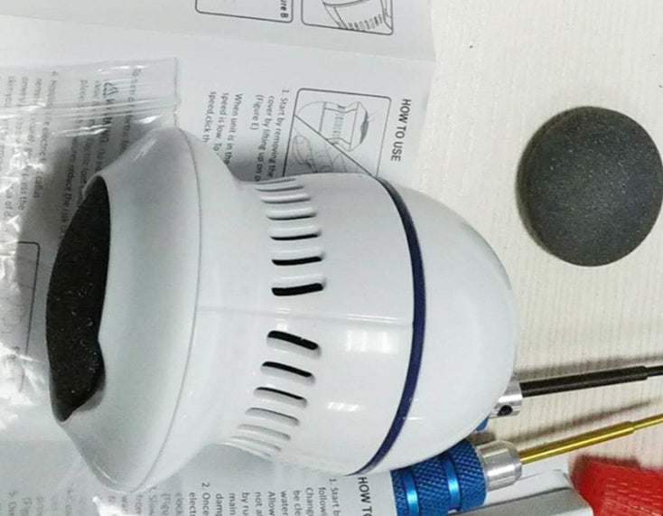 White electric foot file grinder device with included sanding heads and accessories