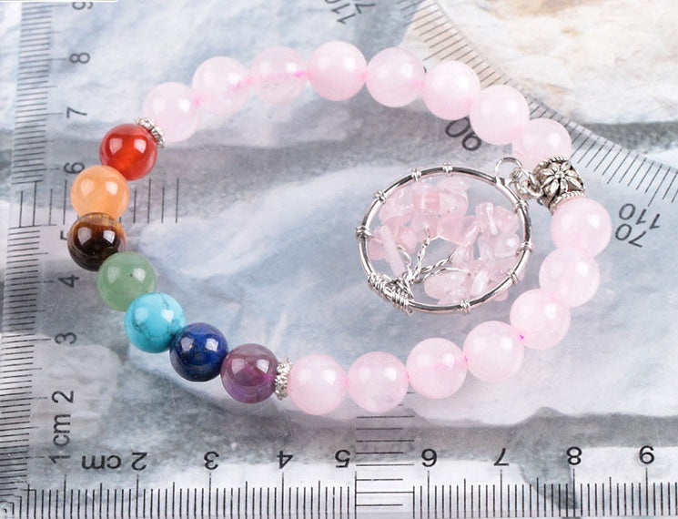 Pink crystal beaded bracelet with round crystal pendant and silver clasp links