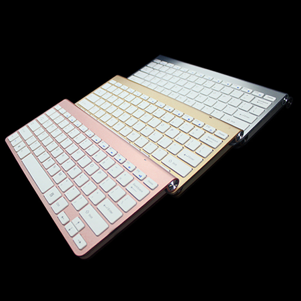 Rose gold wireless mini keyboard and mouse combo in tilted view
