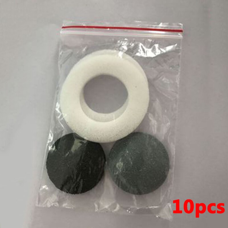 Replacement sanding pads in clear bag: one light ring and two dark discs