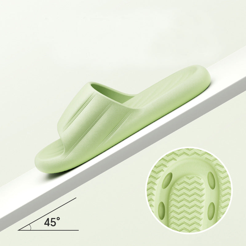 Light green slide slippers with thick sole and molded ribbed tread