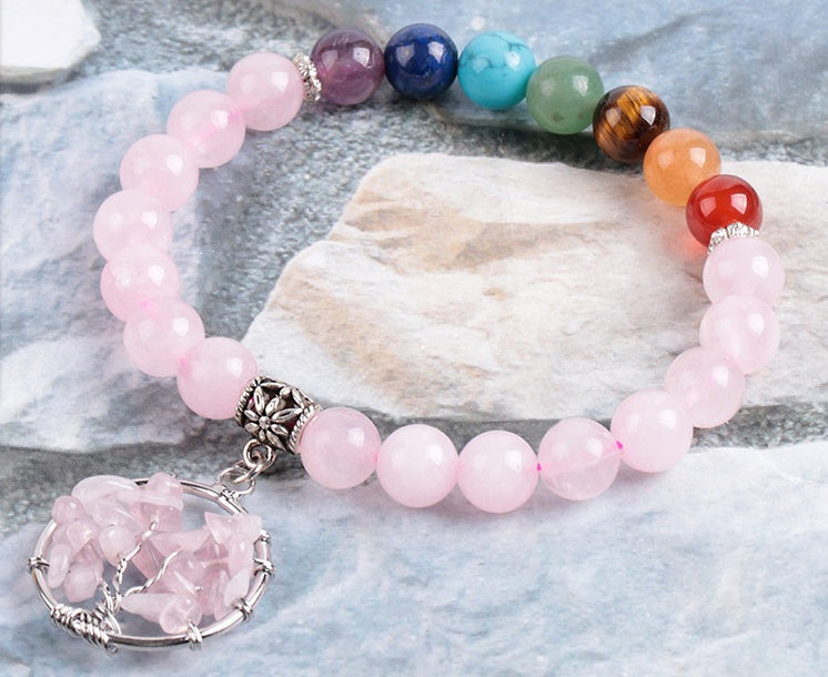 Pink crystal beaded bracelet with multicolor bead section and round rose quartz wire pendant