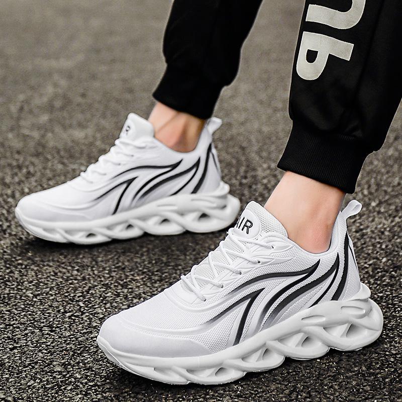White lace-up running shoes with dark curved stripe detail and thick sole
