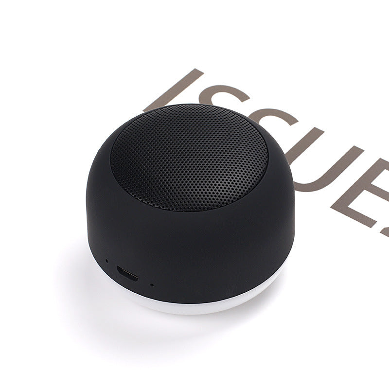 Wireless Bluetooth mini speaker, black with side buttons and textured grille top