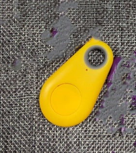 Yellow Bluetooth anti-lost key finder fob with hanging loop.