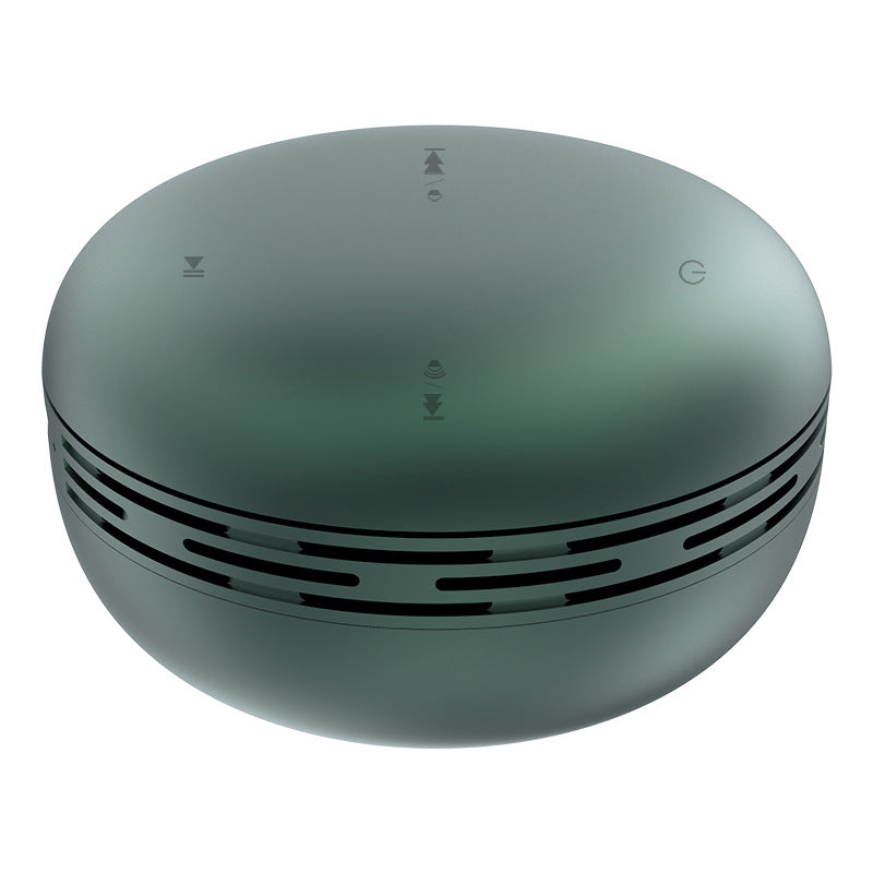 Mini Bluetooth speaker, muted green round design with vented side ring and top control icons