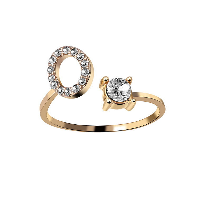 Gold adjustable initial letter ring with round crystal and crystal-set O letter