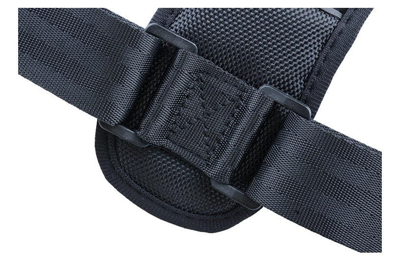Close-up of black webbing strap with adjustment buckle on posture corrector
