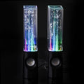 Water fountain LED speaker pair, clear tubes with blue-green glow, black bases and round woofers