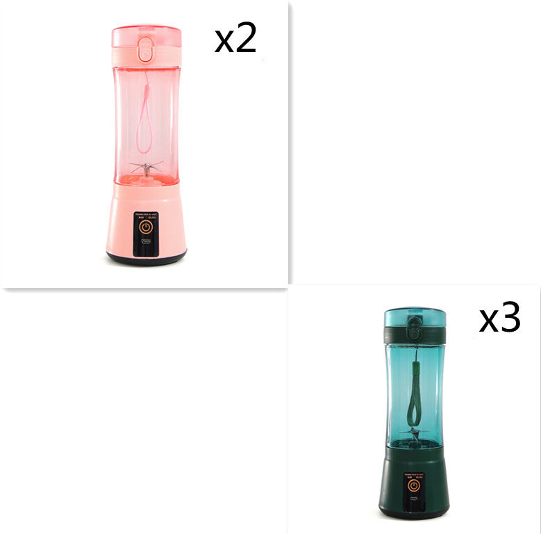Portable electric fruit juicer with pink blender cup and teal blender cup