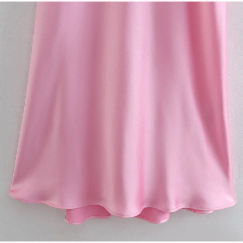 Pink satin slip skirt with flowing drape and gathered hem