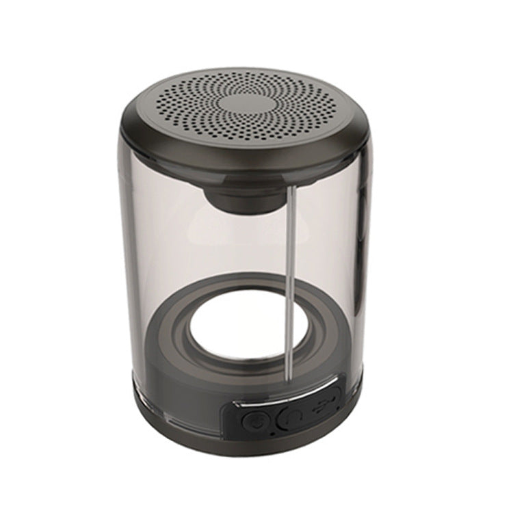 Bluetooth speaker with transparent cylinder body and black top grille, magnetic base