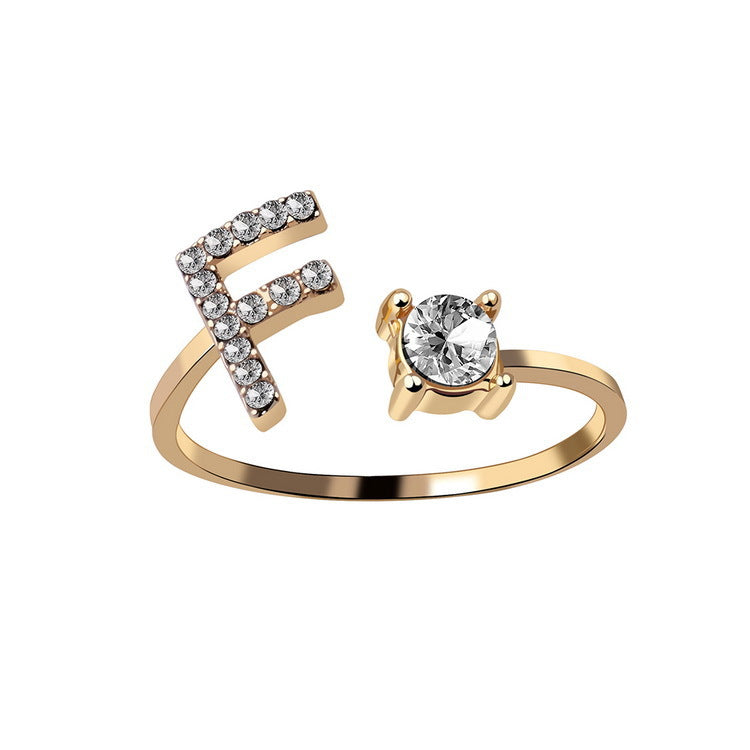 Adjustable initial letter ring with round clear stone, gold-tone pave E-shaped letter