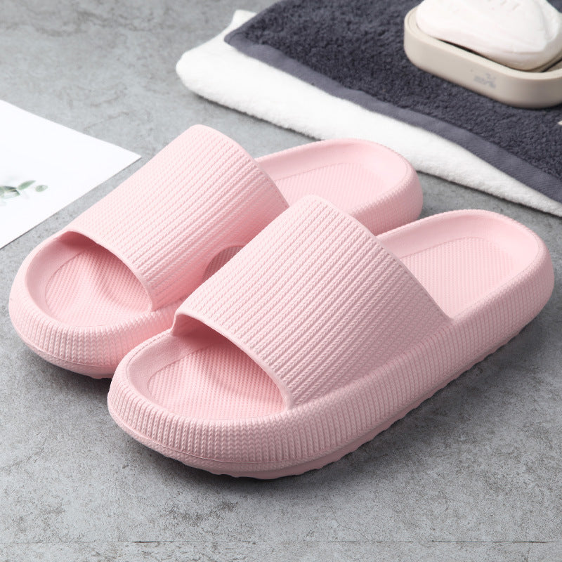 Pink slide slippers with textured wide straps and cushioned sole