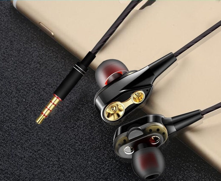 Dynamic headphones with black earbuds and gold ear cup details