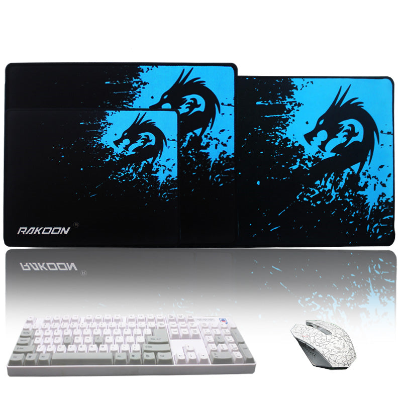 Mouse pad with black and blue dragon splash graphic, rounded stitched border