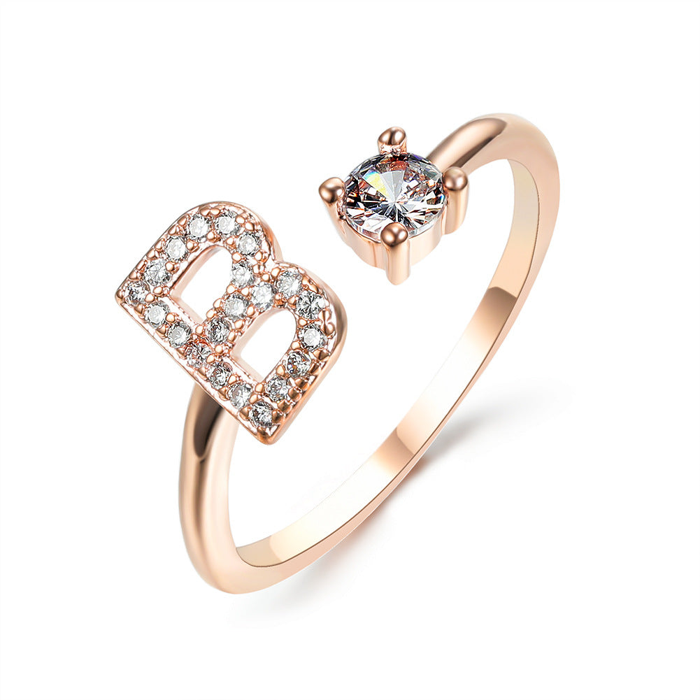 Rose gold initial B ring with round crystal center and pave B detail