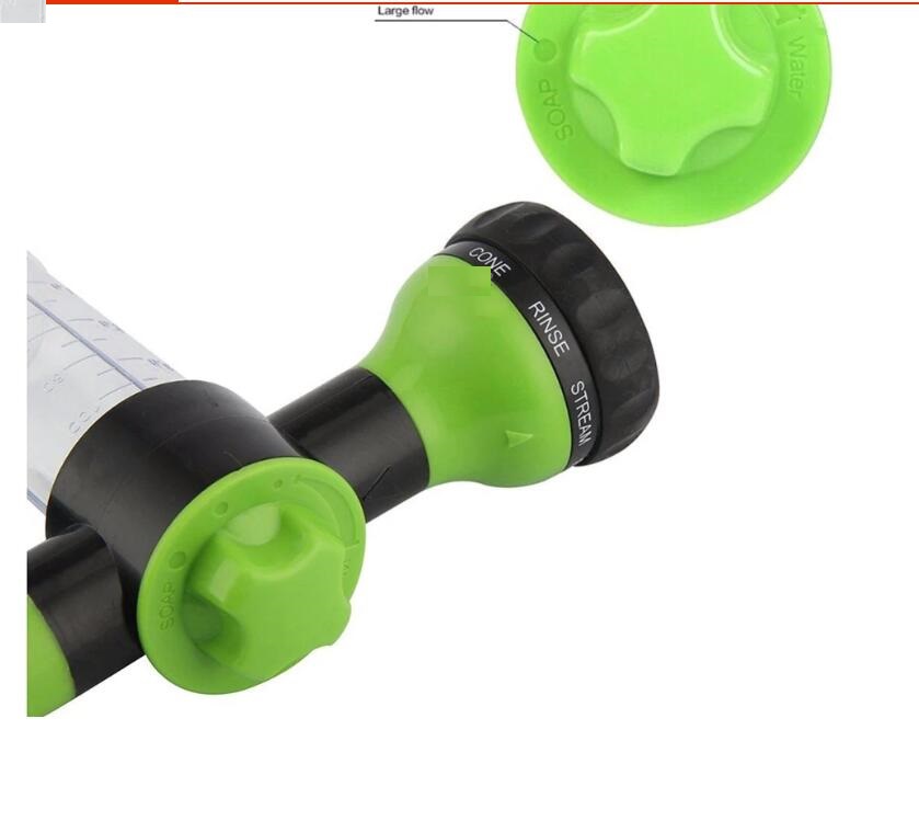 Green and black foam spray nozzle with rotating dial on a spray gun