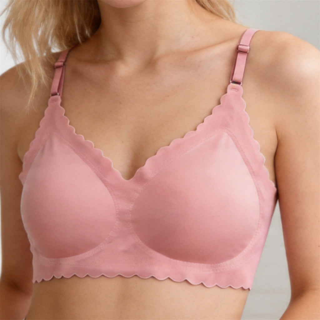 Pink wireless deep V bra with scalloped trim and adjustable shoulder straps