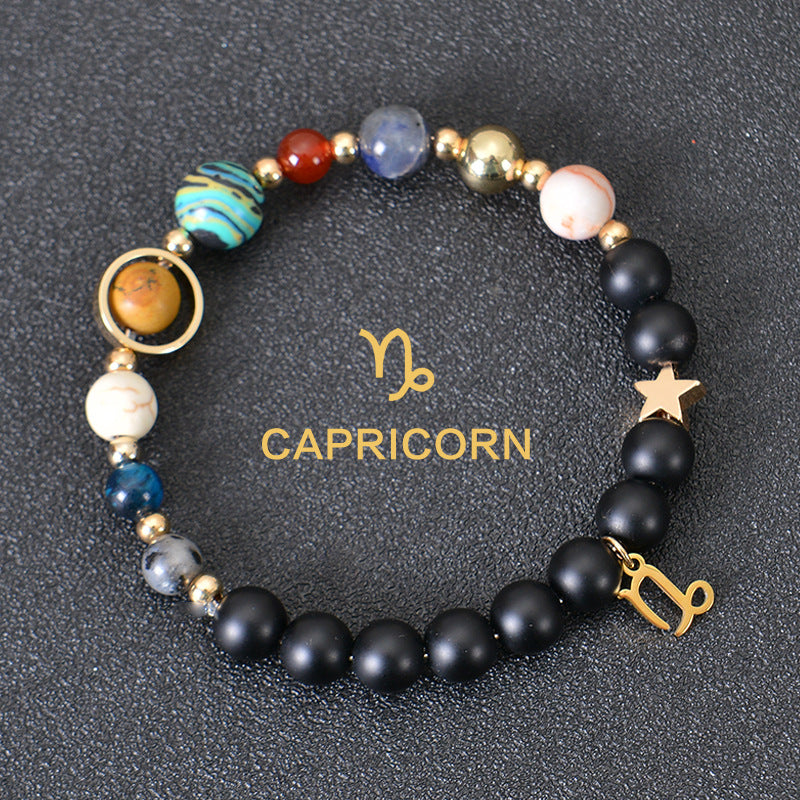 Capricorn zodiac beaded bracelet with black lava stones and star charm, gold accents