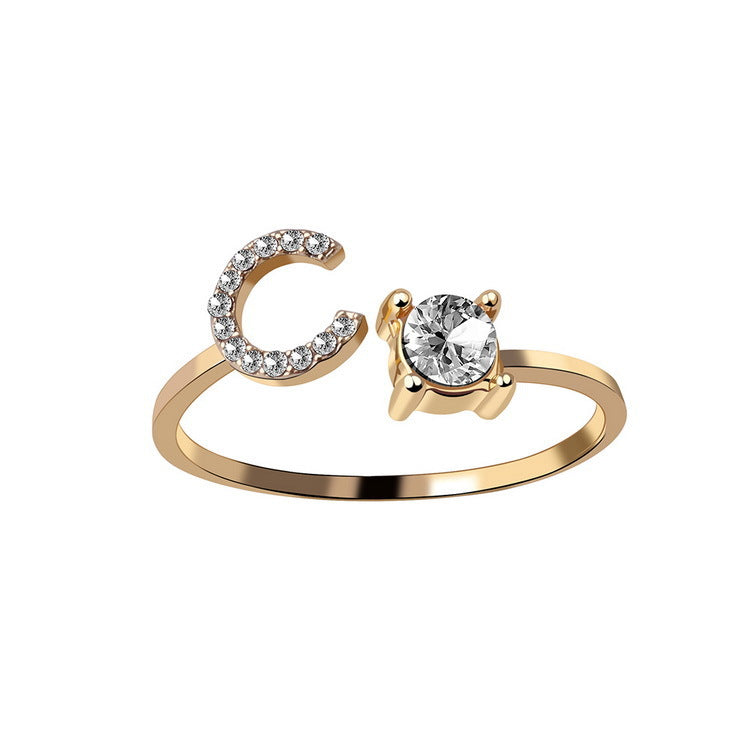 Adjustable initial letter ring with round clear stone, gold-tone pave C-shaped letter