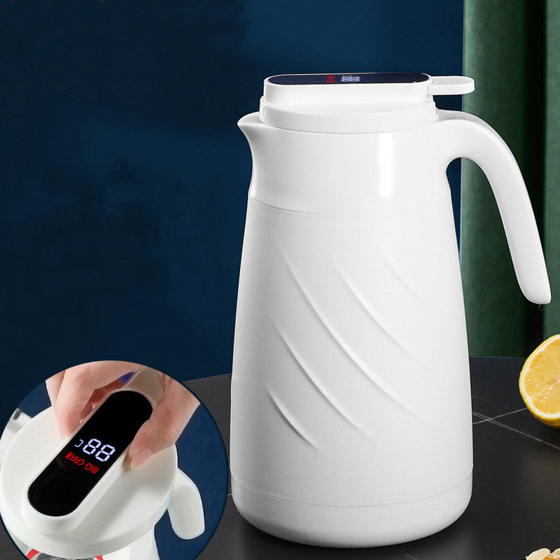White smart water bottle with handle, spout lid, and digital temperature display