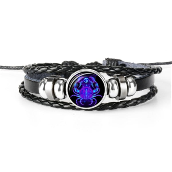Braided leather-look bracelet with round luminous zodiac charm and silver-toned links.