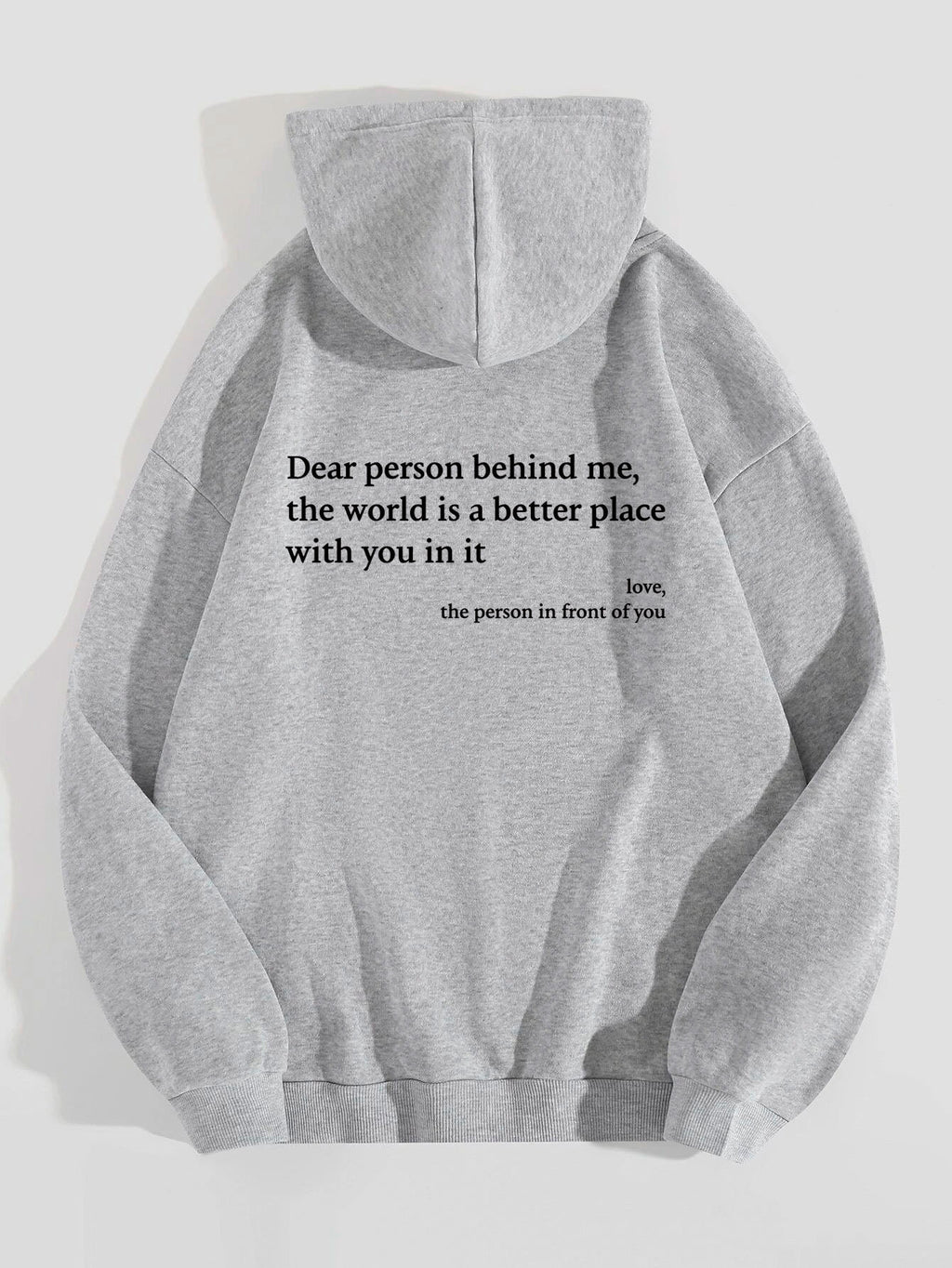 Light gray plush hoodie with hood, drawstrings, kangaroo pocket, and printed back message