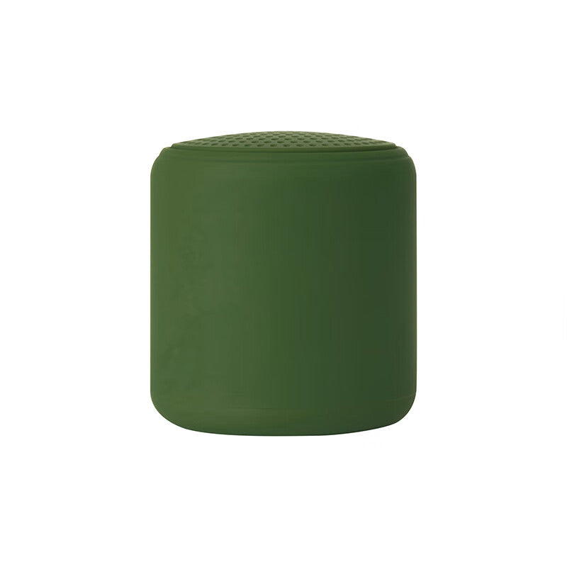 Portable wireless mini speaker, green cylinder with perforated top grille
