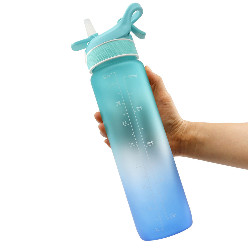 Water bottle with flip straw cover, teal-to-blue gradient, measuring lines on cup.