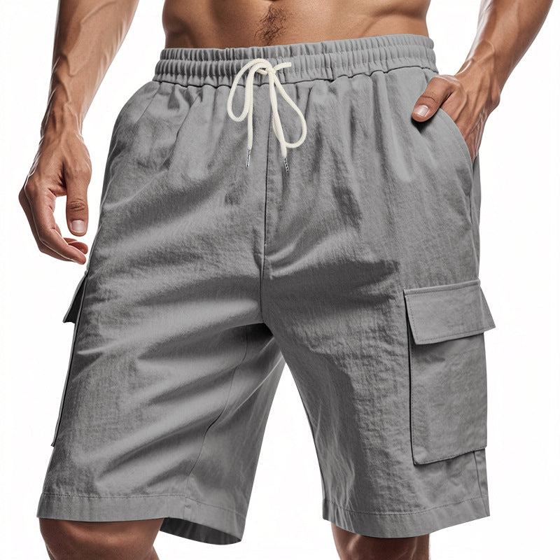 Gray linen cargo shorts with elastic waistband and drawstring, side flap pockets
