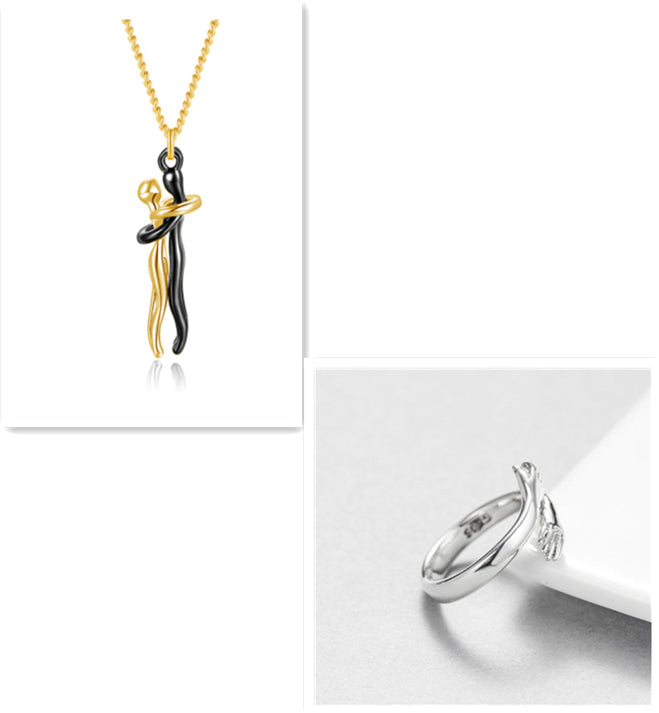 Gold hug-pendant necklace with gold chain and gold-tone ring, polished metal set