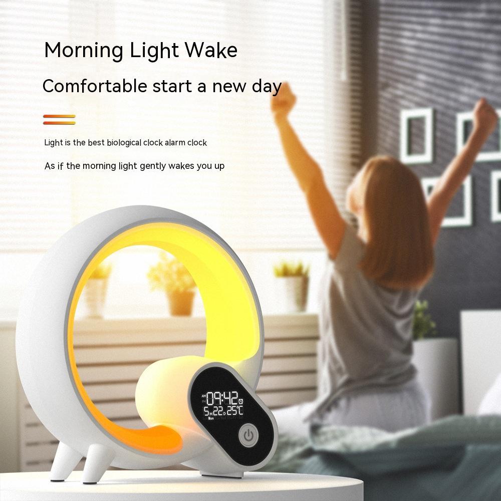 White sunrise alarm clock with warm yellow halo ring light and digital time display