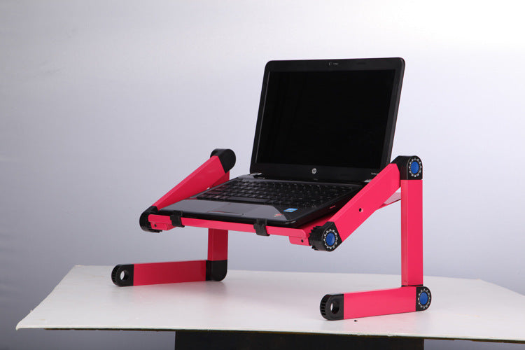 Rose pink adjustable laptop stand with mouse pad, holding a laptop on open frame
