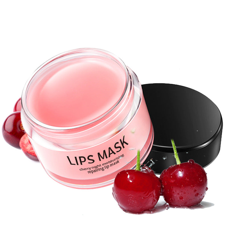 Lips mask jar with pink gel and black lid with cherries in foreground
