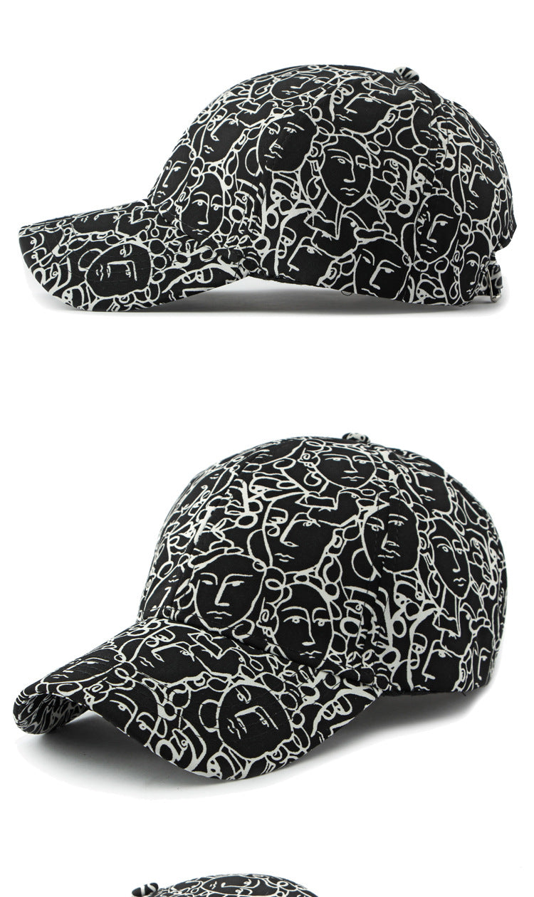 Black retro peaked cap with white face graffiti line pattern, side and front views