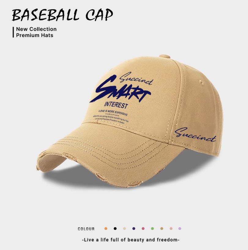 Beige baseball cap with front embroidered logo and cursive “Succinct” lettering