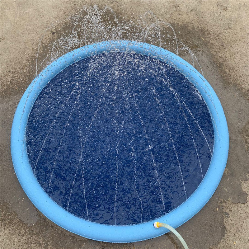 Blue round splash pad with water sprayers over the dark inner mat