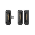 Three black BOYA clip-on radio microphones with USB plugs