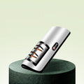 USB rechargeable electric knife sharpener with white body and dark end cap, on round stand