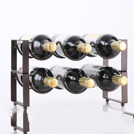 Two-tier black metal wine bottle rack with six curved slots, holding six bottles