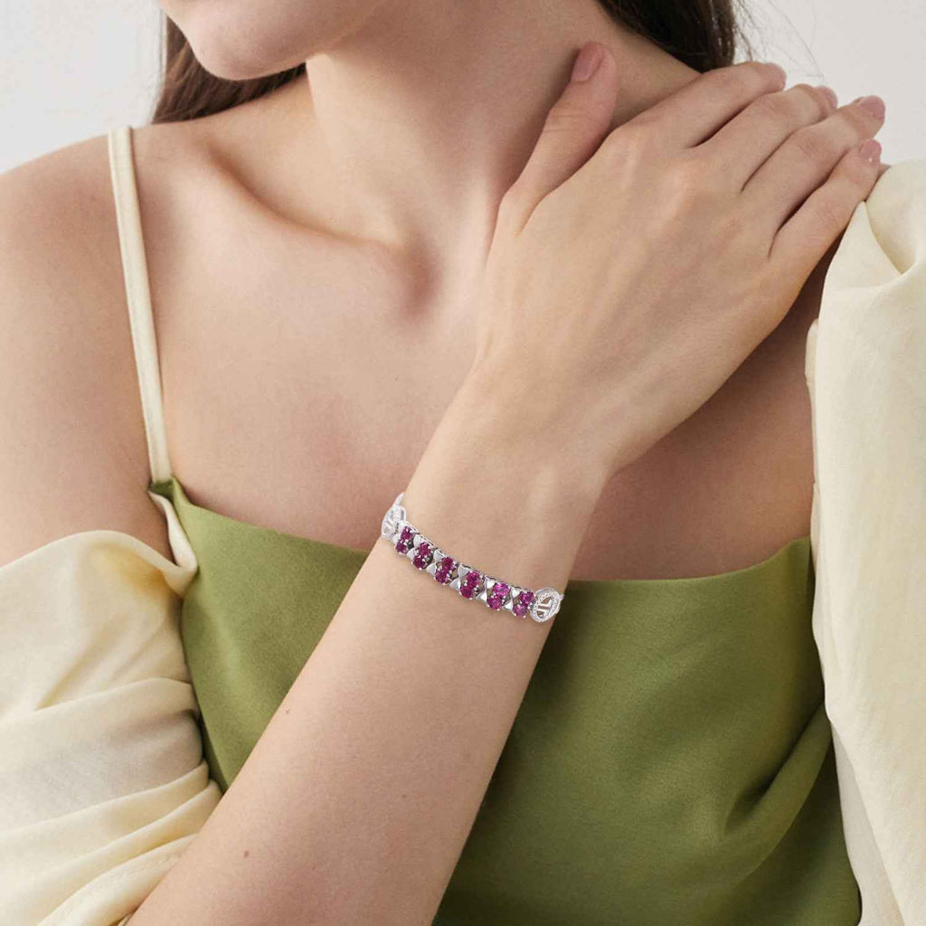 Sterling silver bracelet with purple stones, worn on wrist with rectangular clasp