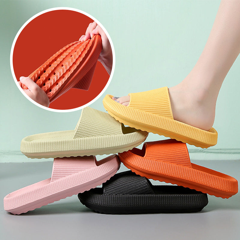 Slide slippers set in yellow, orange, pink, and dark with textured footbed and sole