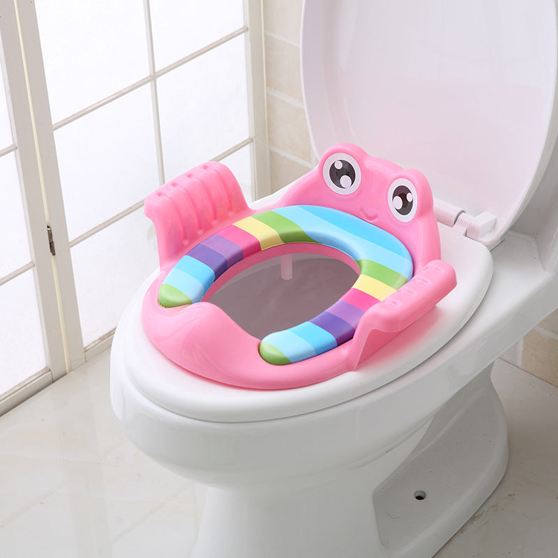 Kids toilet training seat in pink with rainbow arch, cartoon face, raised handles