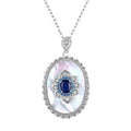 Sapphire diamond oval pendant necklace in sterling silver with blue center stone and link chain