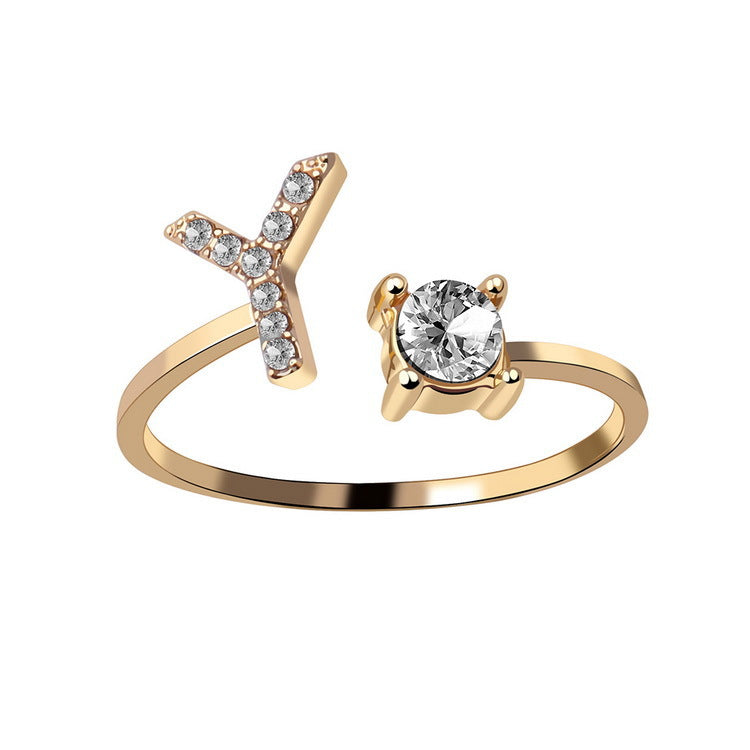 Gold adjustable initial letter ring with round crystal and crystal-set letter