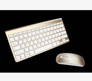Cream/gold wireless mini keyboard and mouse combo, angled