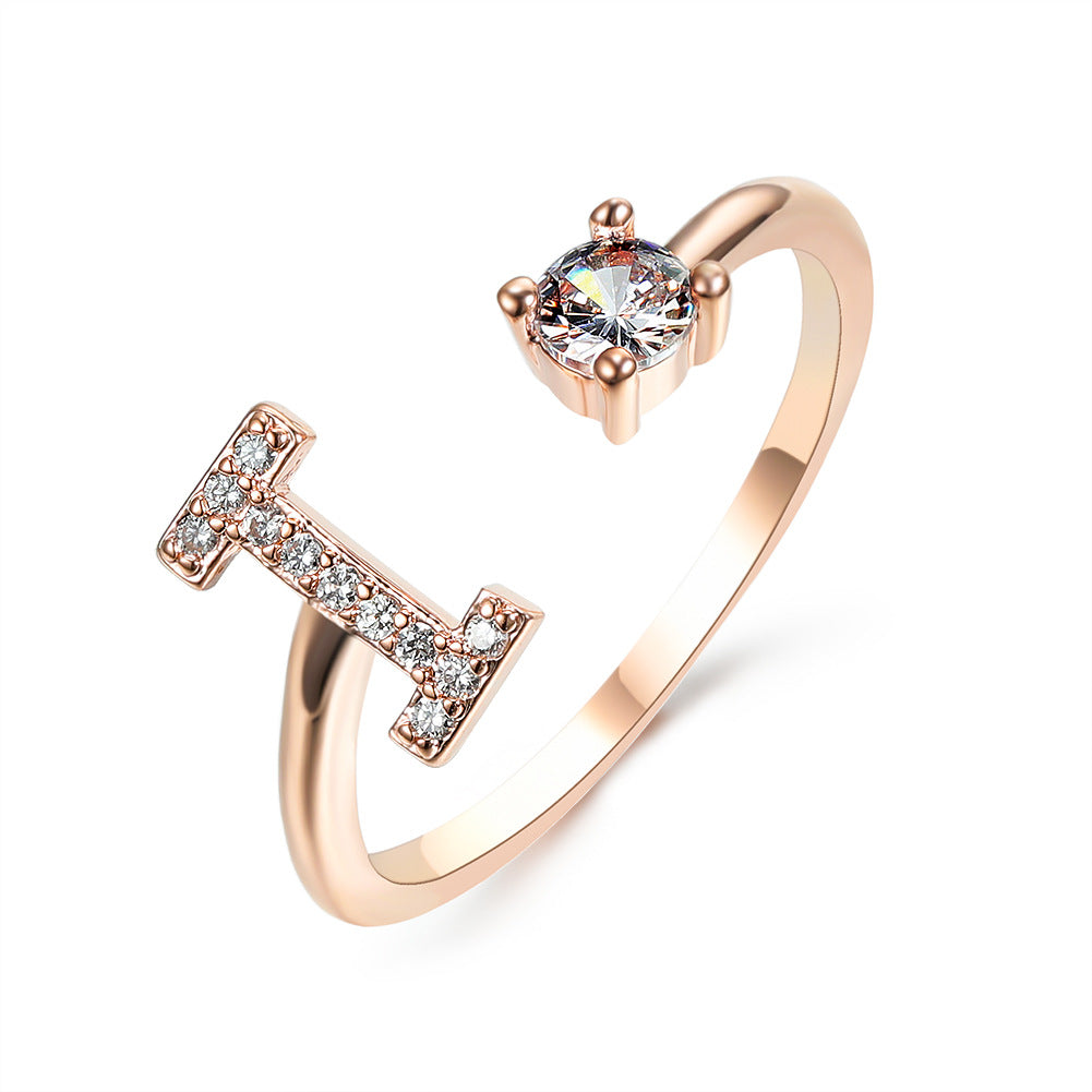 Rose gold initial letter ring with pavé rhinestones and round center crystal