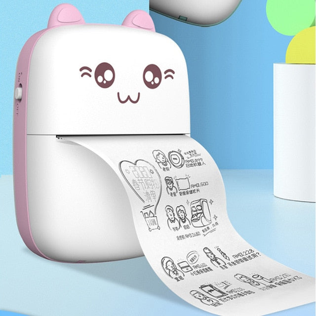 Mini label printer with cat face, pink body, long printed label strip extended